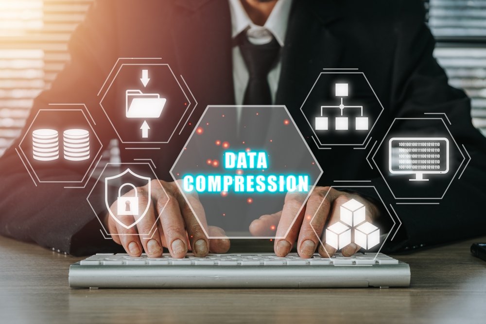 Data,Compression,Concept,,Person,Hand,Typing,Keyboard,Computer,On,Desk