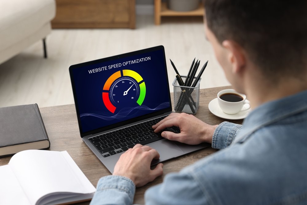 Website,Speed,Optimization.,Man,Using,Laptop,At,Table,,Closeup