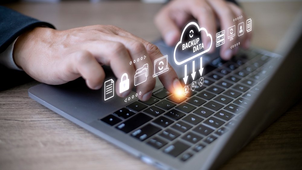Businessman,Using,A,Computer,To,Backup,Storage,Data,Internet,Technology