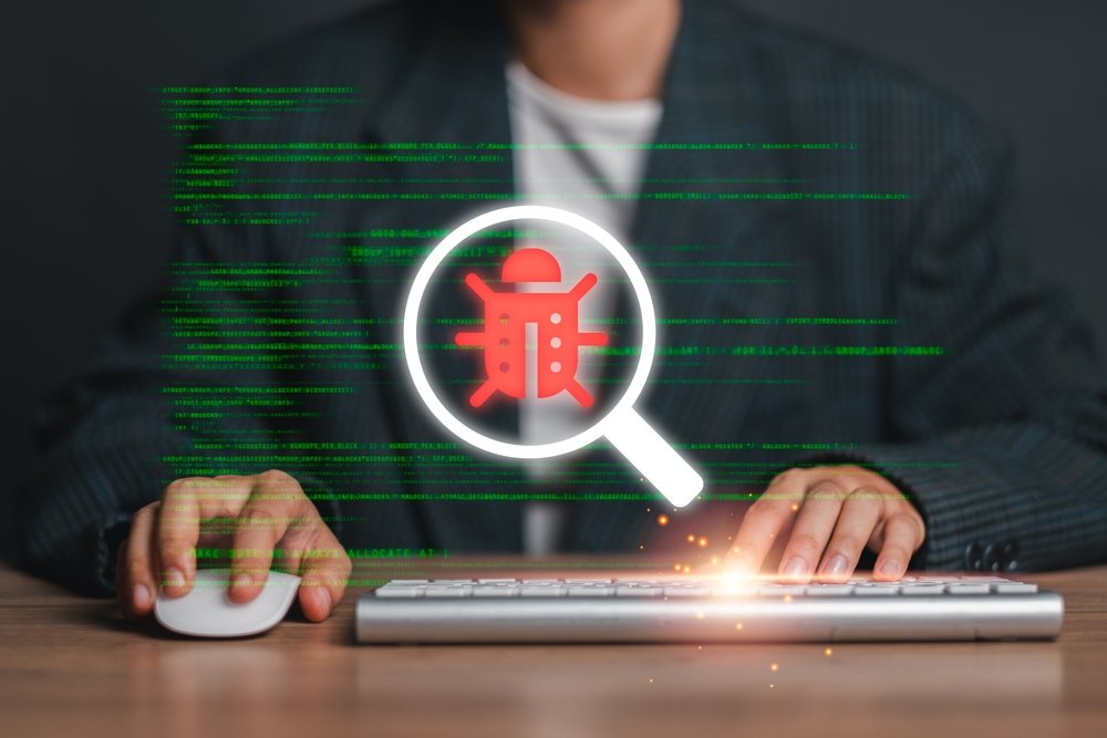Magnifying,Glass,Highlighting,A,Bug,Icon,On,A,Computer,Screen,